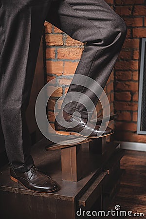 Guy showing his new polished boots Stock Photo