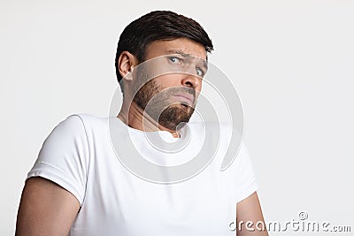 Guy Smelling Unpleasant Stink Frowning Expressing Disgust Over White Background Stock Photo