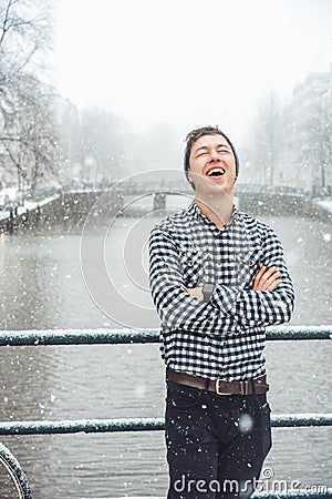 Guy is standing on a bridge Stock Photo