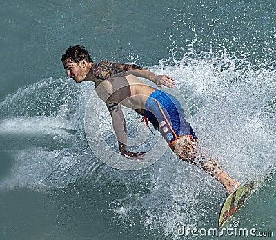 Guy with Tats Surfing Editorial Stock Photo