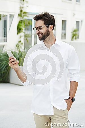 Guy texting on Smartphon Stock Photo