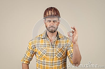 guy wear worker uniform. handsome builder in helmet. mature man wear checkered shirt Stock Photo