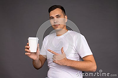 The guy in the white t-shirt recommends coffee Stock Photo