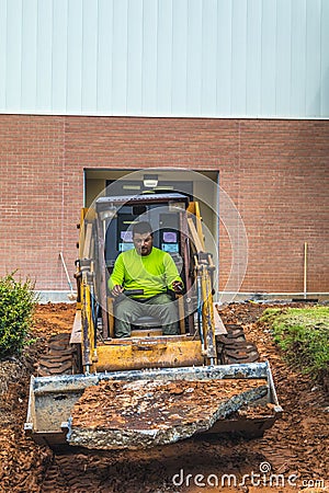 A man operates industrial equipment Editorial Stock Photo