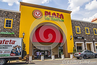 People wearing face masks at Plaza Las Americas Editorial Stock Photo