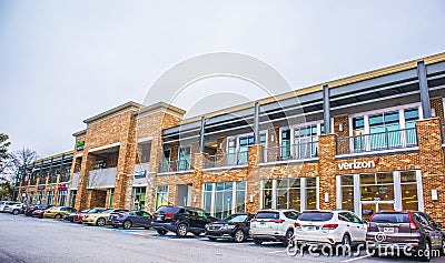 A shopping plaza and cars parked at open stores during covid-19 Editorial Stock Photo