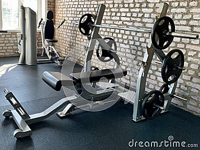 Gym for bodybuilding. Heavy dumbbells and exercise equipment. Barbells and equipment for athletes Editorial Stock Photo