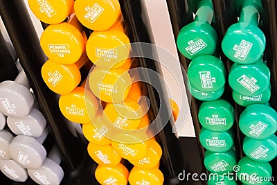 Gym equipment, barbells in assorted colors Editorial Stock Photo