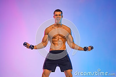 Happy man athlete with dumbbell on pink background. Gym full body workout. Muscular man athlete in fitness gym have havy Stock Photo