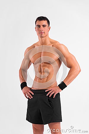 Man athlete isolated on white background. Gym full body workout. Muscular man athlete in fitness gym have havy workout Stock Photo