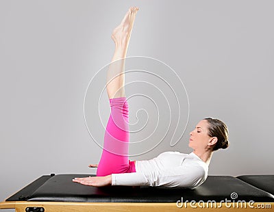 Gym pilates woman reformer yoga leg sport Stock Photo