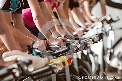 Gym shot - people cycling; spinning class Stock Photo