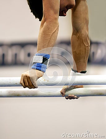 Gymnast on parallel bars Stock Photo