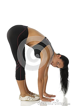 Gymnastic girl strecthing body Stock Photo