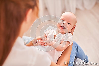 Gymnastics baby. woman doing exercises with baby for its development. massage a small newborn baby Stock Photo