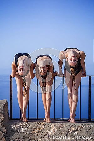 Gymnasts, dancers outdoors stretching Stock Photo
