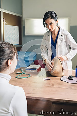 Gynecological doctor teaching breast self-examination Stock Photo