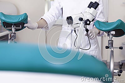 Gynecological room gynecologist chair equipment doctor female hands lens microscope optics Stock Photo