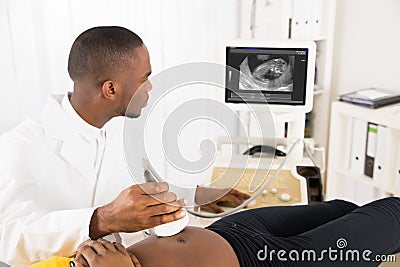 Gynecologist Checking Pregnant Woman`s With Ultrasound Stock Photo