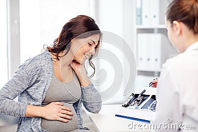 Gynecologist doctor and pregnant woman at hospital Stock Photo
