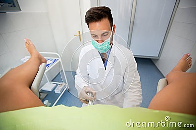 Gynecologist examining a patient Stock Photo