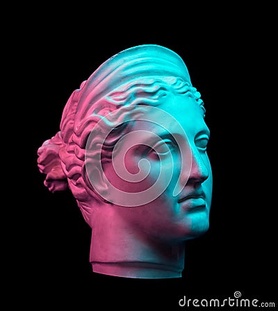 Gypsum copy of ancient statue Diana head isolated on black background. Plaster sculpture woman face. Stock Photo