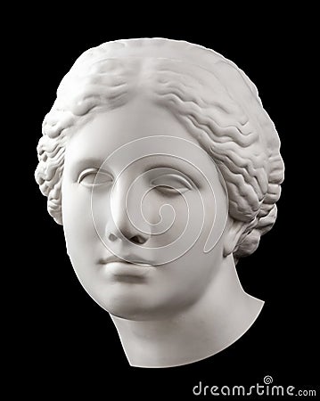 Gypsum copy of ancient statue Venus head isolated on black background. Plaster sculpture woman face. Stock Photo