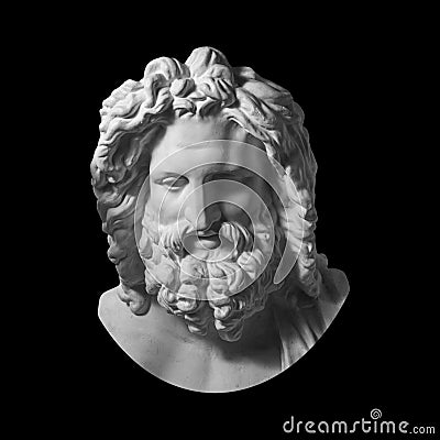 Gypsum copy of antique statue Zeus head isolated on black background. Plaster sculpture man face with beard. Stock Photo