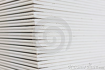 Gypsum plasterboard in the pack. The stack of gypsum board preparing for construction. Pallet with plasterboard in the building Stock Photo