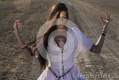 Gypsy woman on the dirty road 3 Stock Photo