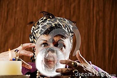 Gyspy seen in a crystal ball Stock Photo