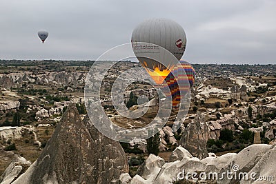 View from the observation deck of the village of GÃ¶reme on the flight of balloons over the valleys Editorial Stock Photo