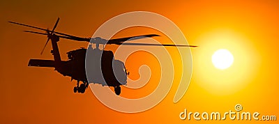 H-60 helicopter at sunset Stock Photo