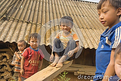 Ha Giang, Vietnam - Apr 12, 2014: Unidentified Hmong children playing on playground in front of there houses under sunlight. The H Editorial Stock Photo