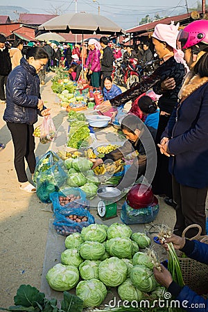Ha Giang, Vietnam - Feb 14, 2016: Rural local market in Van district, Ha Giang. The trading goods are almost homemade things Editorial Stock Photo