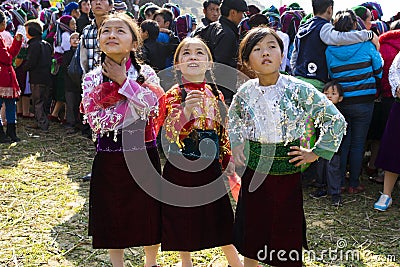 Ha Giang, Vietnam - Feb 7, 2014: Unidentified group of children wearing Hmong traditional new year clothe, waiting for their danci Editorial Stock Photo
