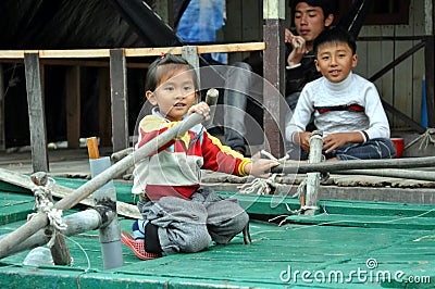 Ha Long bay - Little girl from the local floating village Editorial Stock Photo