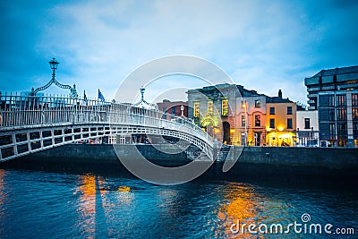 Ha`Penny Bridge over the River Liffey seen at dusk Stock Photo