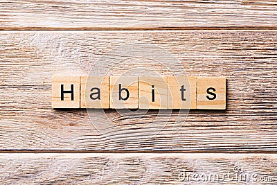 HABITS word written on wood block. HABITS text on wooden table for your desing, concept Stock Photo
