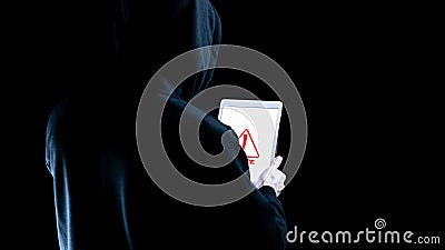 Hacker tablet cyber security. Digital mobile phone in hacker man hand isolated on black banner. Internet web hack Stock Photo