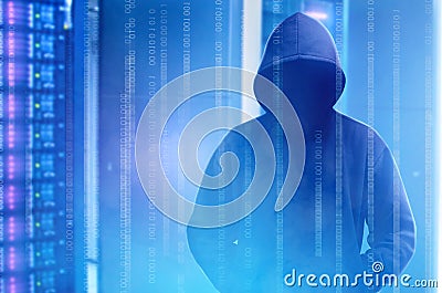 Hacker in black hoodie standing with binary code on virtual screen Stock Photo