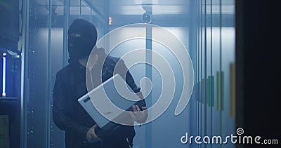 Hacker breaking server software and destroying computers Stock Photo