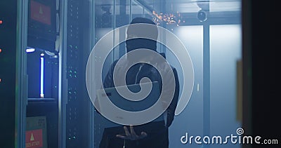 Hacker breaking server software and destroying computers Stock Photo