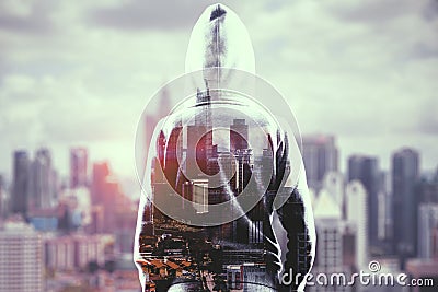 Hacker on city background Stock Photo