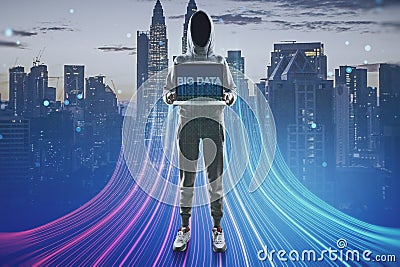 Hacker with computer and abstract glowing big data or metaverse hologram on blurry city background. Future, hacking and digital Stock Photo