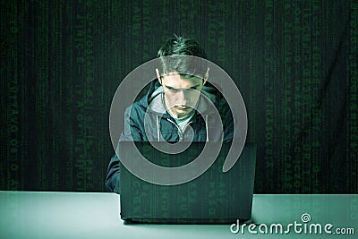 Hacker in the dark breaks the access to steal information Stock Photo