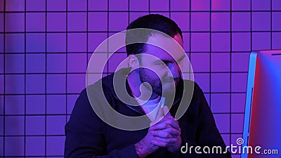 Hacker with evil look programing. Stock Photo