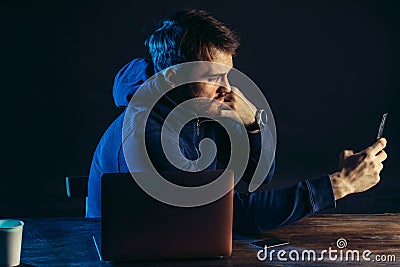 Hacker finding and exploiting the weakness in computer systems to gain access. Stock Photo