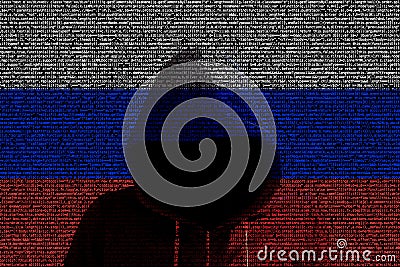 Hacker shininhg through russian computer code flag Stock Photo