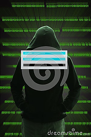 Hacker sitting at the desk with binary codes on transparency Stock Photo